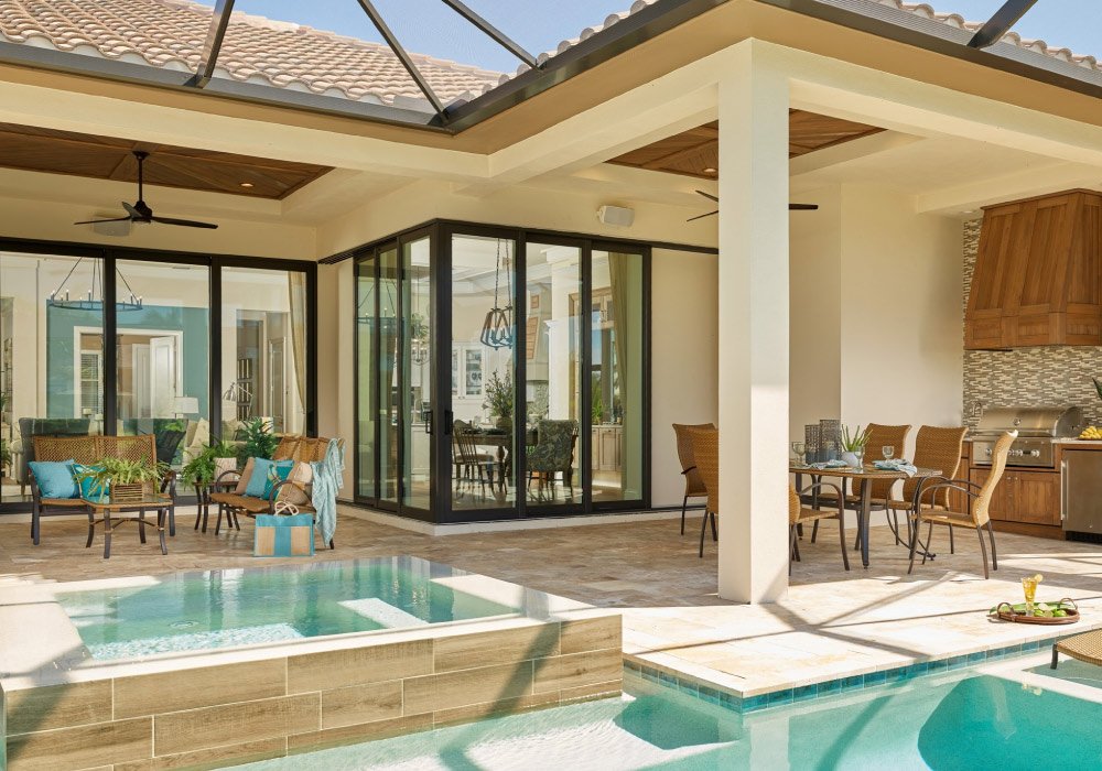 Luxury home with 6-panel sliding glass door opening to pool — MACROBUILD installation